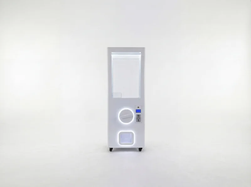 White gashapon machine with illuminated capsule window and dispensing control, catalogue visualisation